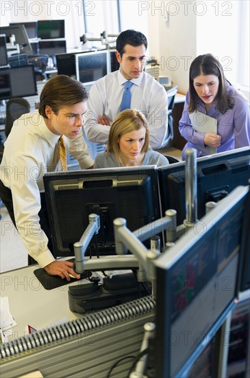 Traders at trading desk.