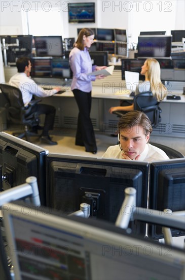 Traders at trading desk.