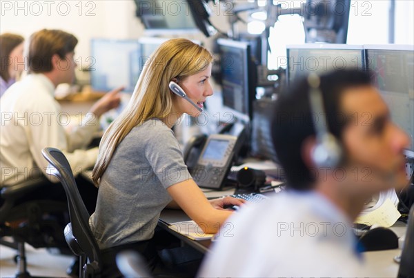 Traders at trading desk.