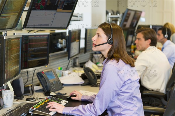 Traders at trading desk.