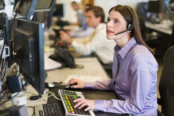 Traders at trading desk.