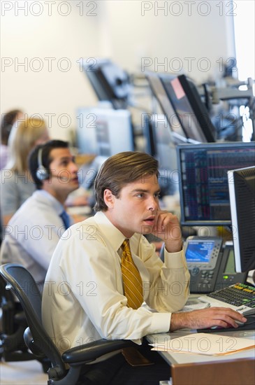 Traders at trading desk.