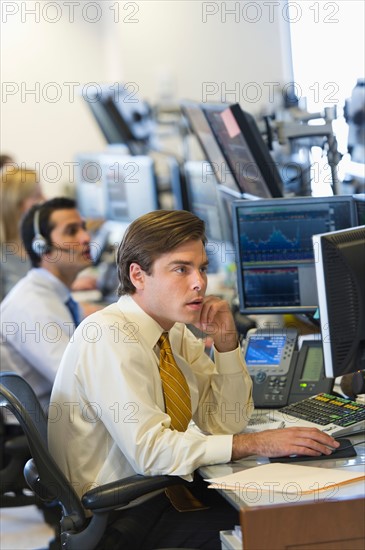 Traders at trading desk.