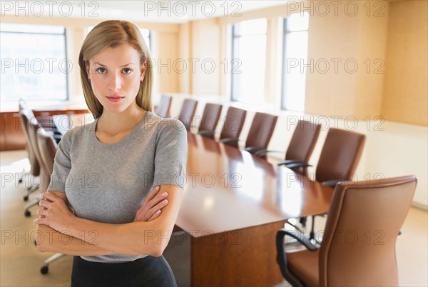 Portrait of businesswoman in board room.