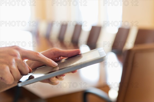 Hands of businesswoman using tablet pc.