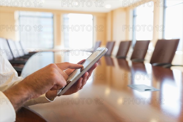 Hands of businessman using tablet pc.