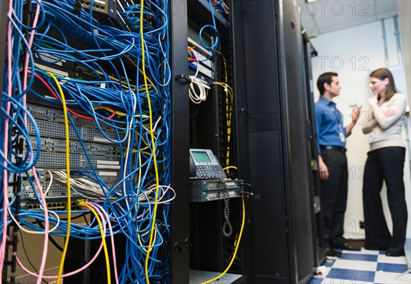 IT support technicians in server room.