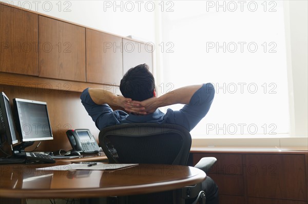 Businessman sitting in office.