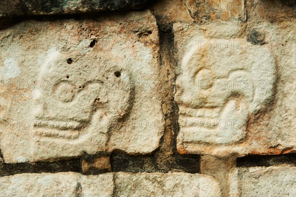 Mexico, Yucatan, Chichen Itza. Mayan carvings representing human skulls.
