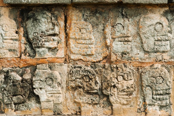 Mexico, Yucatan, Chichen Itza. Mayan carvings representing human skulls.