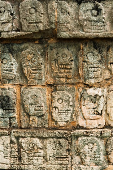 Mexico, Yucatan, Chichen Itza. Mayan carvings representing human skulls.