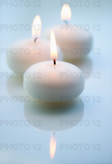 Studio shot of white candles.