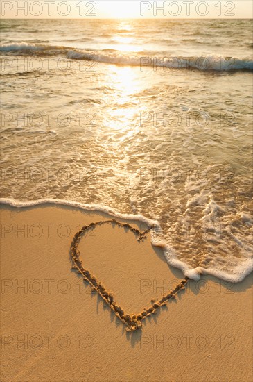 Mexico, Yucatan. Heart drawn in sand on beach.