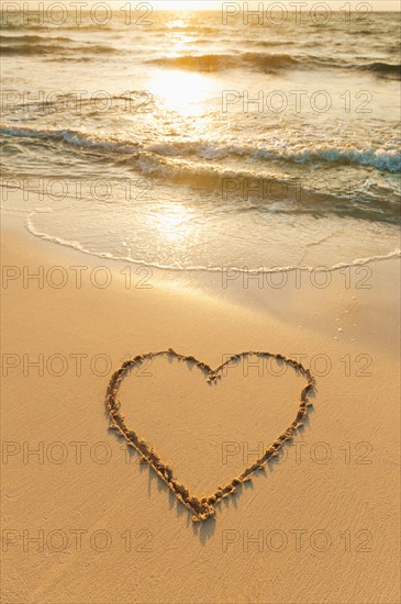 Mexico, Yucatan. Heart drawn in sand on beach.