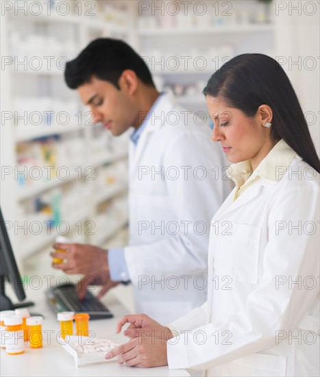 Two pharmacists in pharmacy.