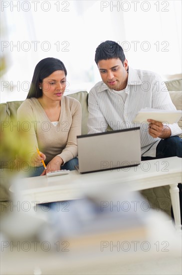 Couple using laptop.