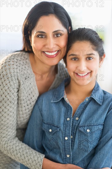 Portrait of mother and daughter (12-13).