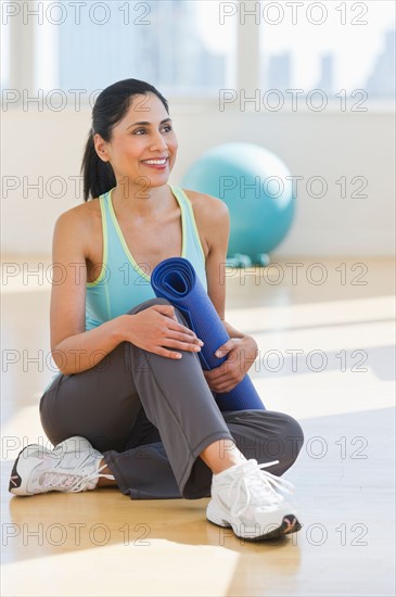 Woman exercising in gym.