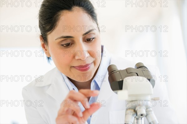 Scientist examining medical sample.