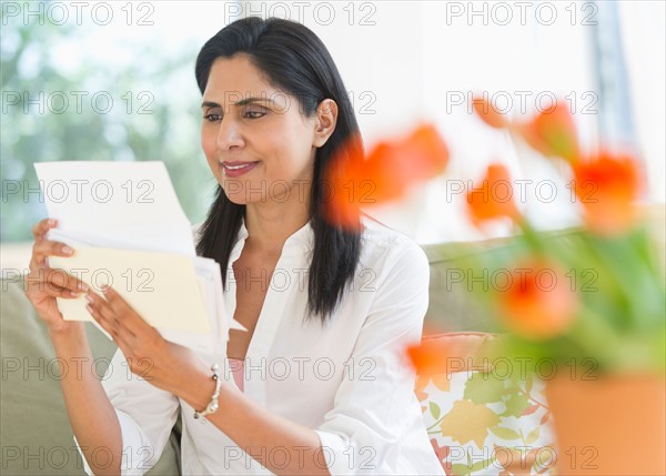 Woman reading letter.