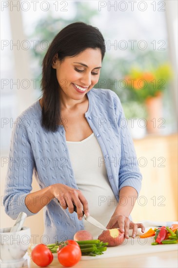 Woman cutting vegetables.