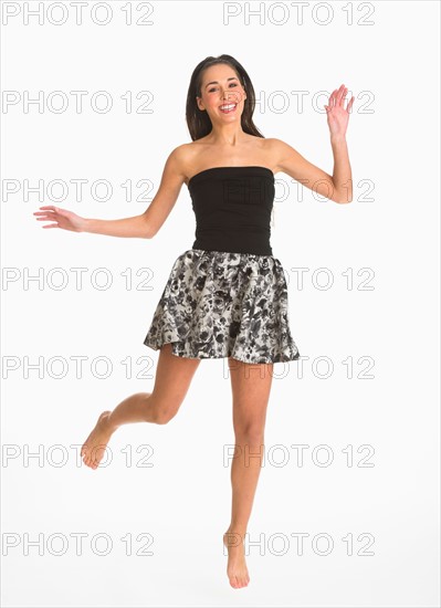 Studio shot of enthusiastic woman.