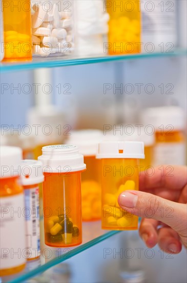 Pill bottles on shelf.