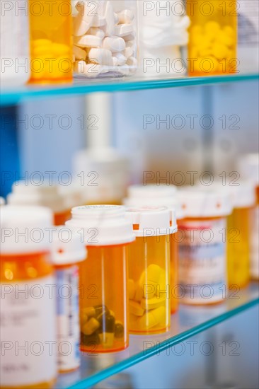 Pill bottles on shelf.