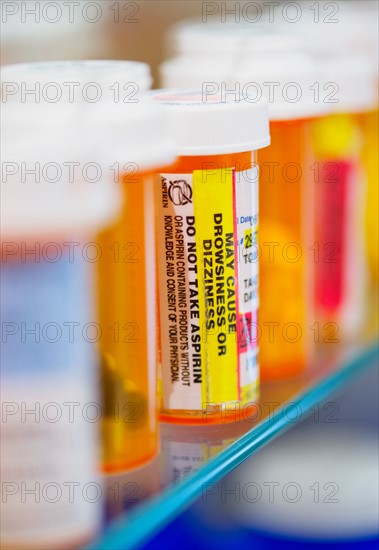 Pill bottles on shelf.