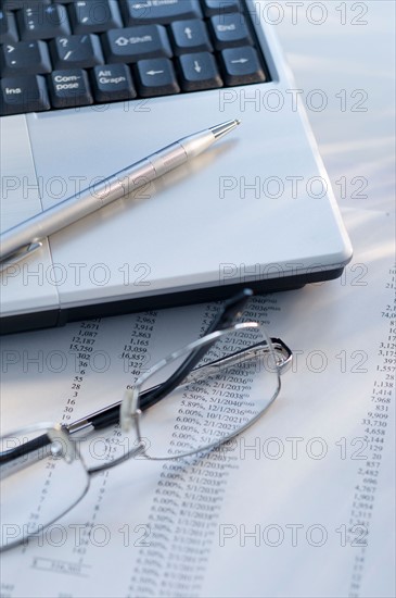 Laptop and glasses.