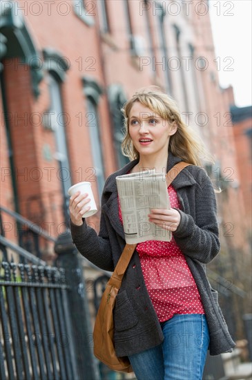 Woman walking on street.