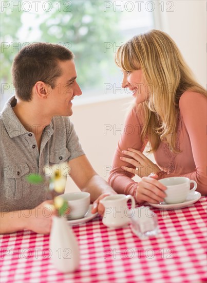 Couple sitting at table.