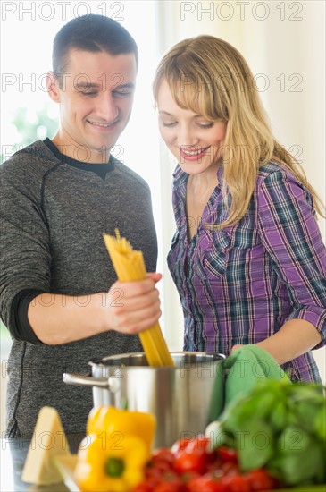 Couple cooking together.