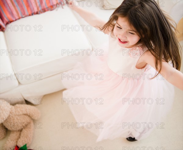 Small girl (4-5 years) dancing in tulle dress. Photo : Jamie Grill