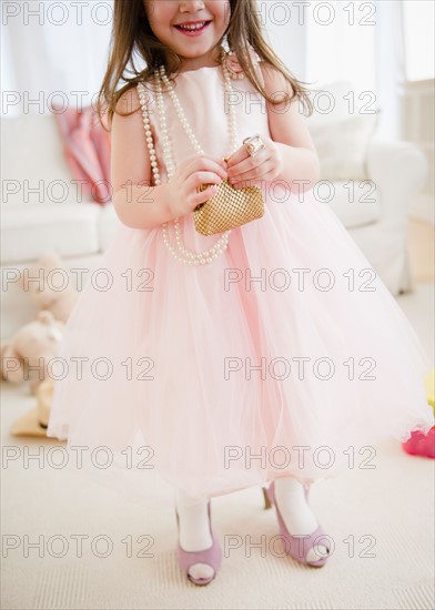 Small girl  (4-5 years) wearing  tulle dress and high heels. Photo : Jamie Grill