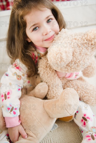 Portrait of small girl  (4-5 years) with puppets. Photo : Jamie Grill