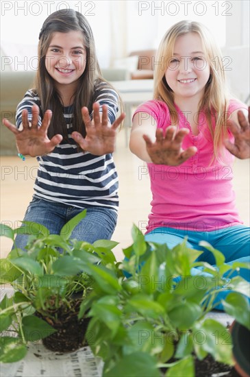 Two girls gardening. Photo : Jamie Grill