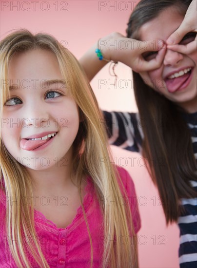 Close up of two girls making faces. Photo : Jamie Grill