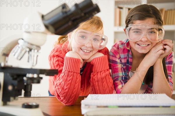 Two girls sitting in school lab. Photo : Jamie Grill