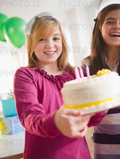 Two girls celebrating birthday. Photo : Jamie Grill