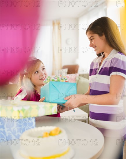 Two girls celebrating birthday. Photo : Jamie Grill