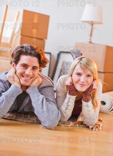 Couple lying  on floor. Photo : Daniel Grill