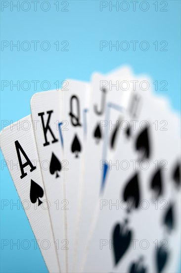 Studio shot of playing cards showing royal flush. Photo : Winslow Productions