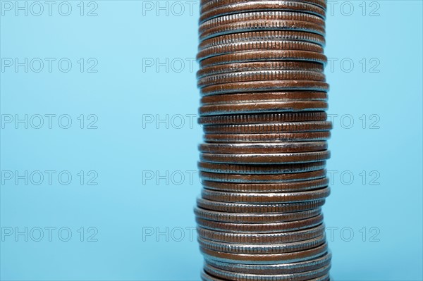 Studio shot of stack of coins. Photo : Winslow Productions