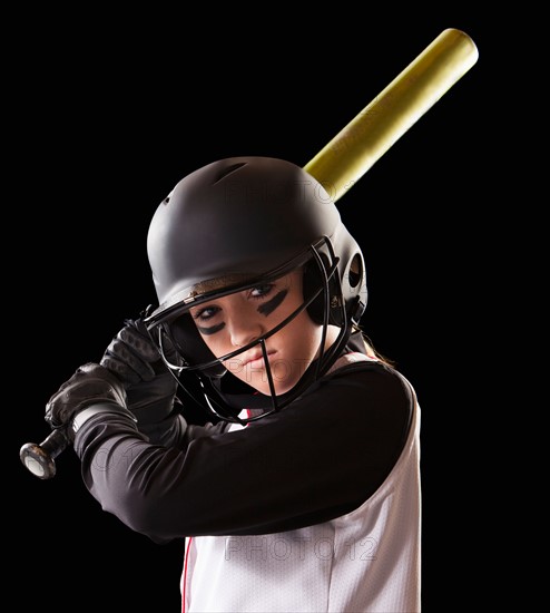 Portrait of girl (12-13) plying softball. Photo : Mike Kemp