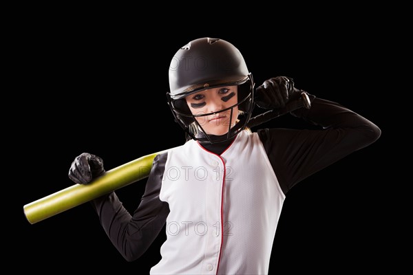 Portrait of girl (12-13) plying softball. Photo : Mike Kemp