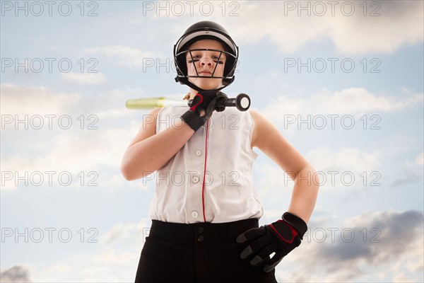 Portrait of girl (12-13) plying softball. Photo : Mike Kemp