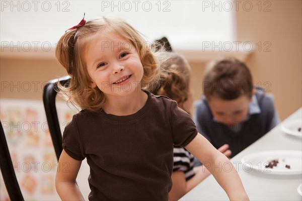 Portrait of girl (2-3) in kindergarten. Photo : Mike Kemp