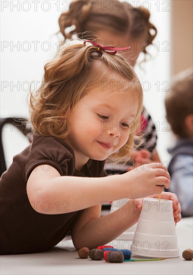 Girl (2-3) playing in kindergarten. Photo : Mike Kemp