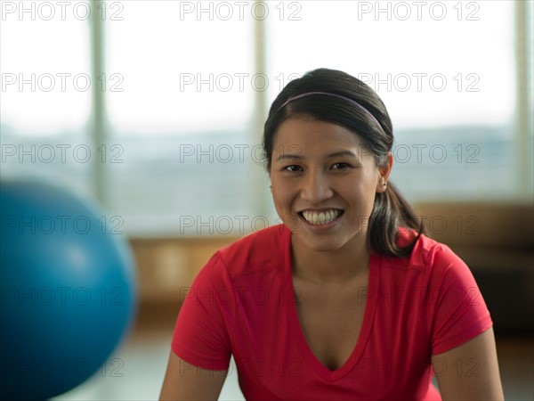 Portrait of Young woman exercising at home. Photo : Dan Bannister